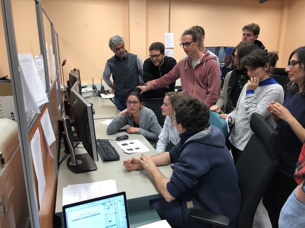 The group of students in the control room of the TNG
        during the 2019